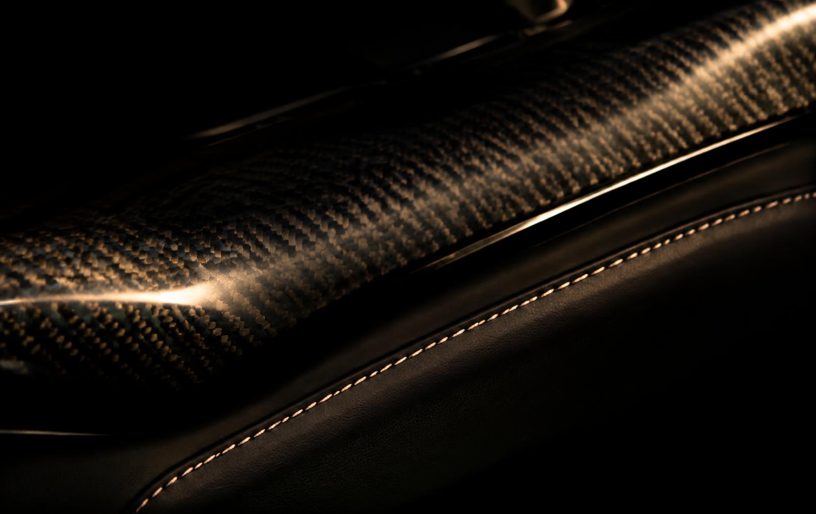 Carbon fibre and stitched leather detail